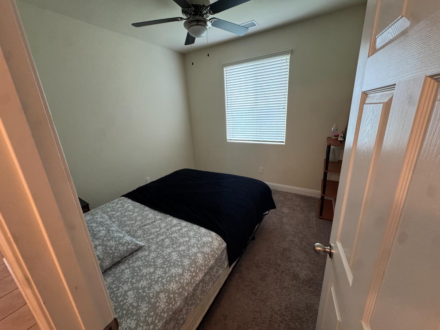 1726 Cleveland Street Selma, CA 93662 - Photo 13 of 17 a bedroom with a bed and a window