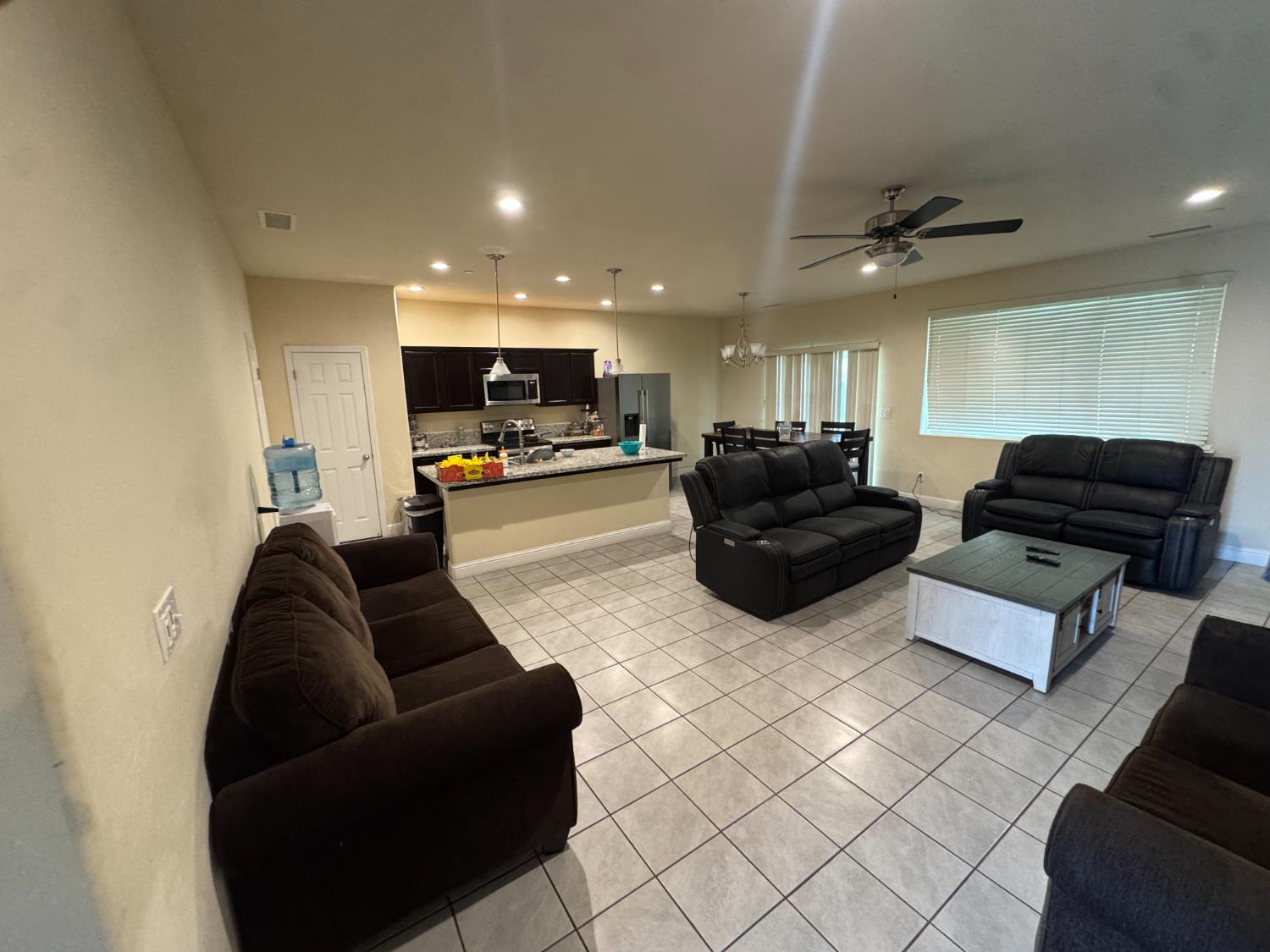 1726 Cleveland Street Selma, CA 93662 - Photo 2 of 17 a living room with furniture and a flat screen tv