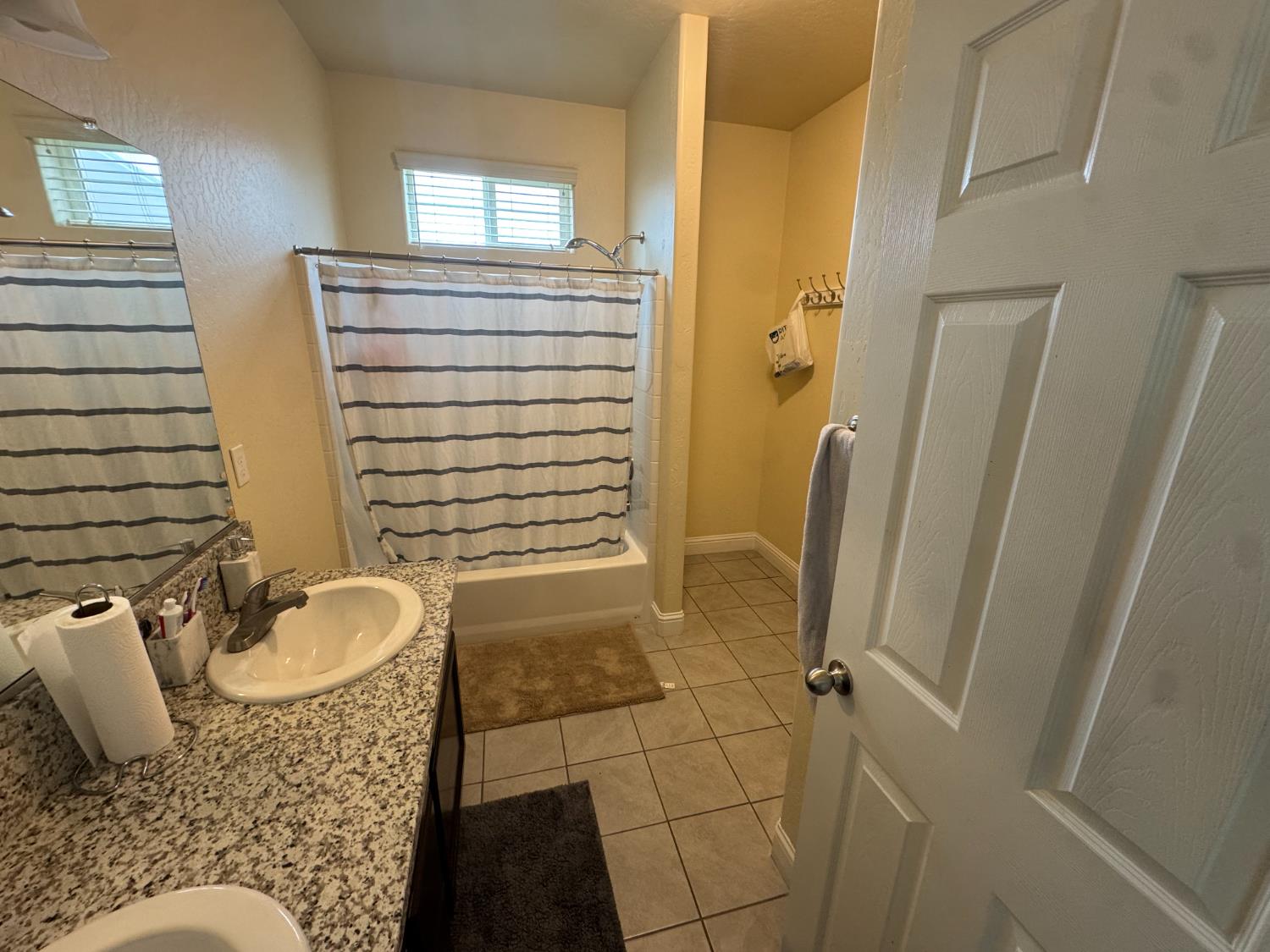 1726 Cleveland Street Selma, CA 93662 - Photo 7 of 17 a bathroom with a sink toilet and shower