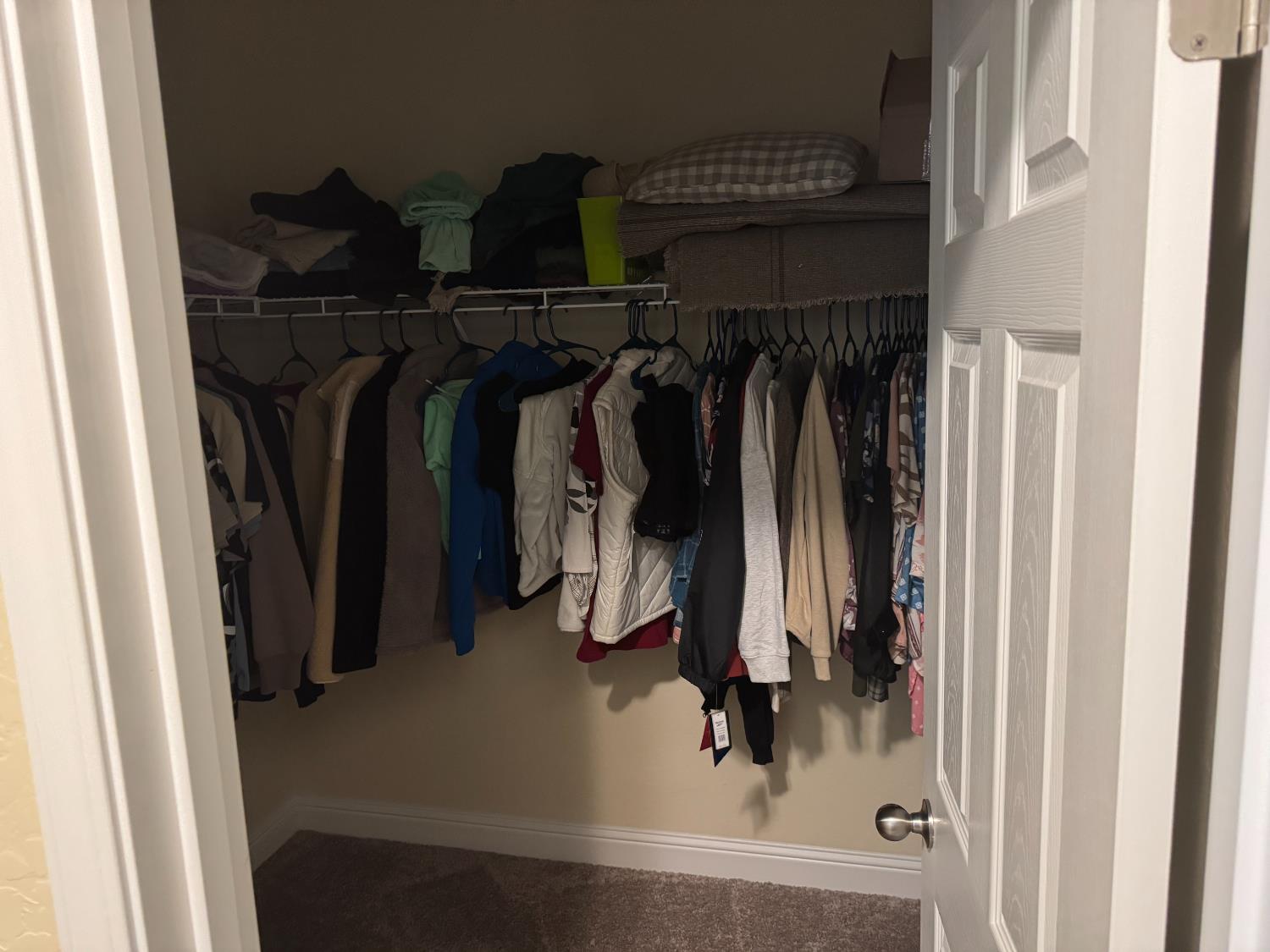 1726 Cleveland Street Selma, CA 93662 - Photo 10 of 17 a view of walk in closet with clothes and shoes