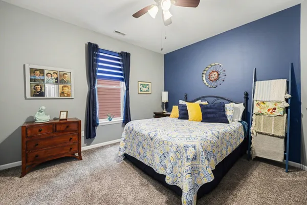 a bedroom with furniture and a bed