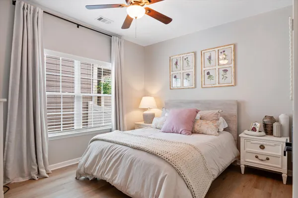 a bedroom with a large bed and a window