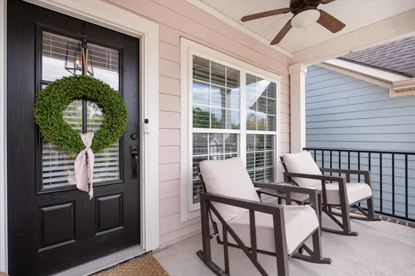 a view of a porch with furniture and a window