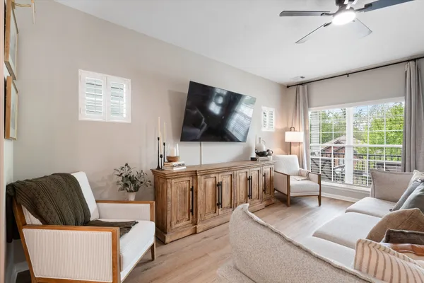 a living room with furniture and a flat screen tv