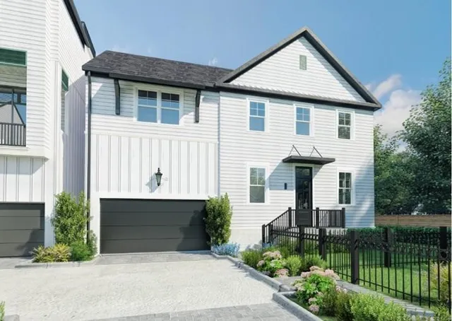 a front view of a house with a garage