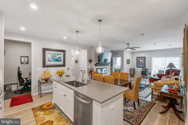 a large white kitchen with lots of counter top space