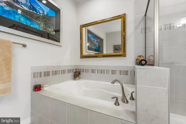 a bathroom with a bathtub and a sink