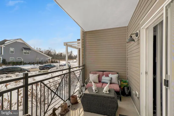 a view of balcony with furniture