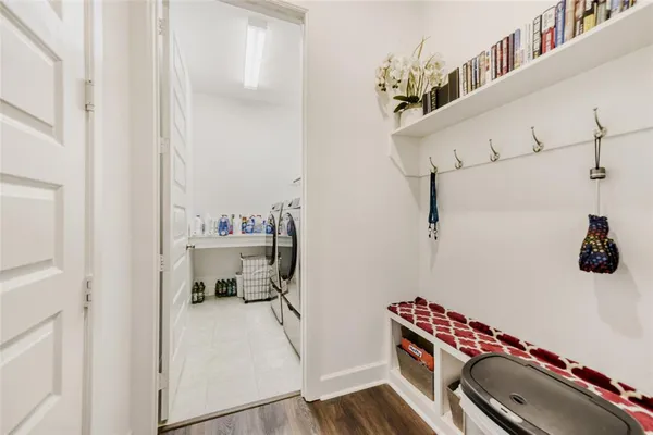 a bathroom with a sink mirror and toilet
