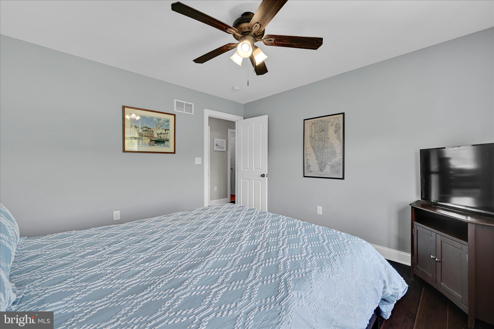 678 Integrity Drive Lititz, PA 17543 - Photo 26 of 51 a bedroom with a bed and a chandelier
