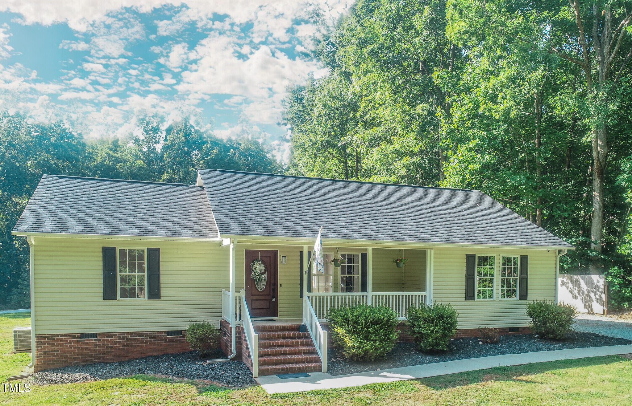 137 Dandelion Drive Timberlake, NC 27583 - Photo 1 of 53 front view of a house with a yard