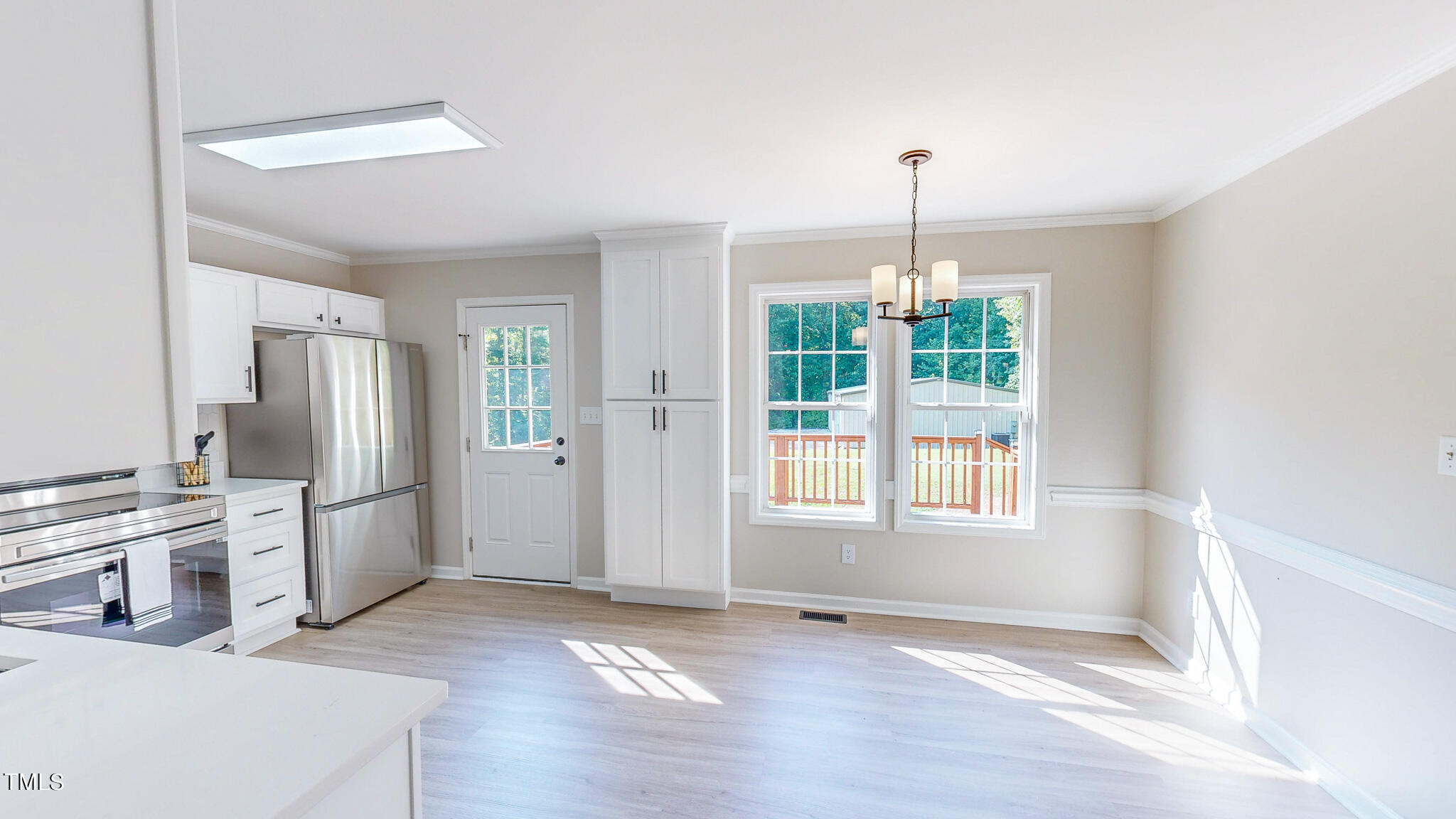 137 Dandelion Drive Timberlake, NC 27583 - Photo 11 of 53 a kitchen with stainless steel appliances granite countertop a stove a sink and a refrigerator