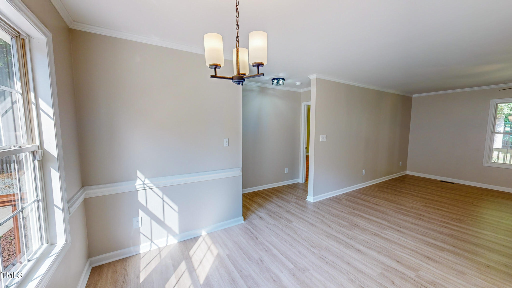 137 Dandelion Drive Timberlake, NC 27583 - Photo 14 of 53 a view of empty room with wooden floor and window