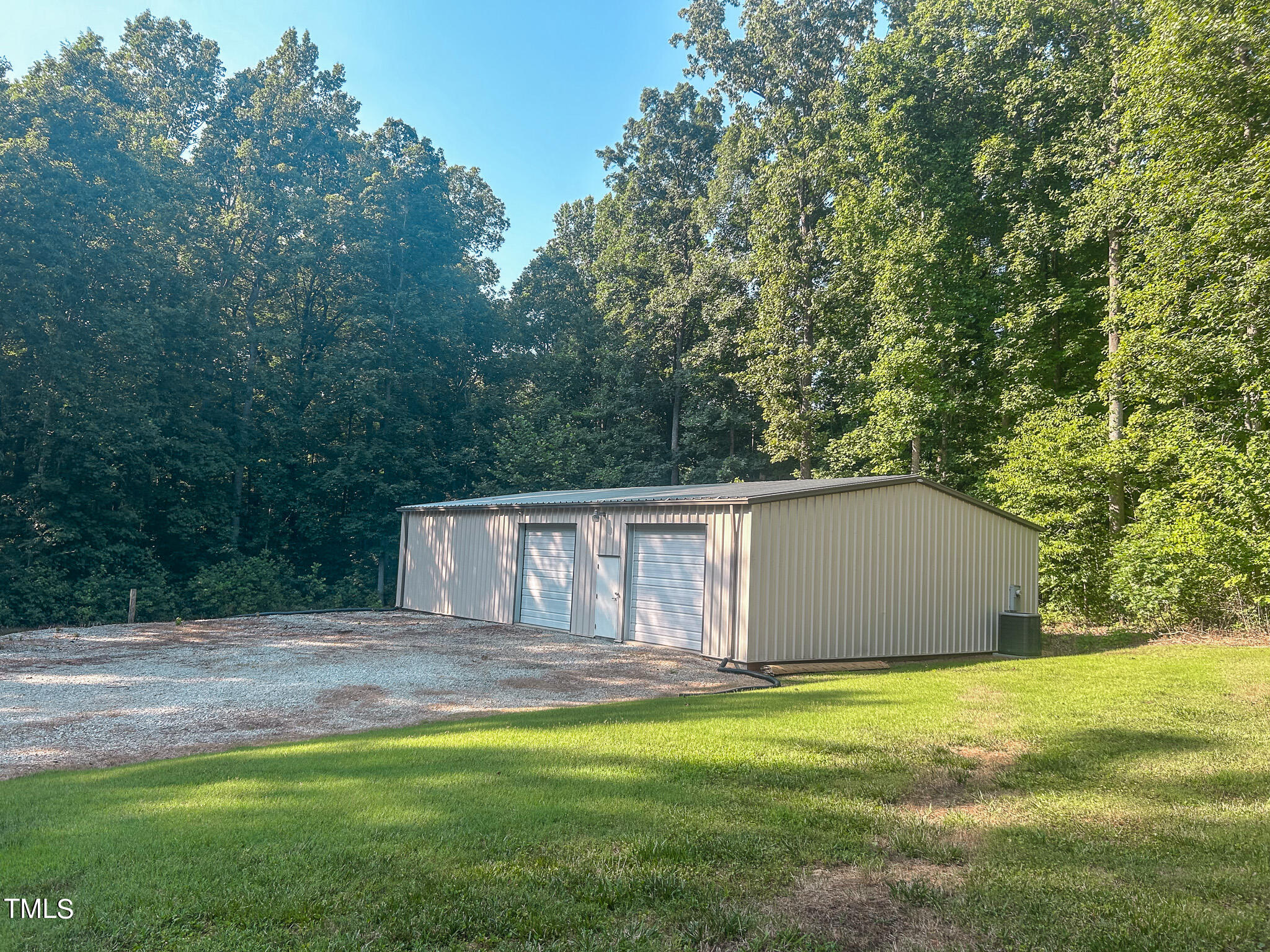 137 Dandelion Drive Timberlake, NC 27583 - Photo 21 of 53 a house view with a garden space