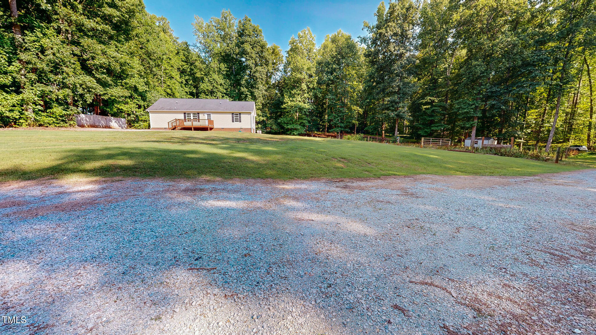 137 Dandelion Drive Timberlake, NC 27583 - Photo 22 of 53 a view of a big yard with large trees