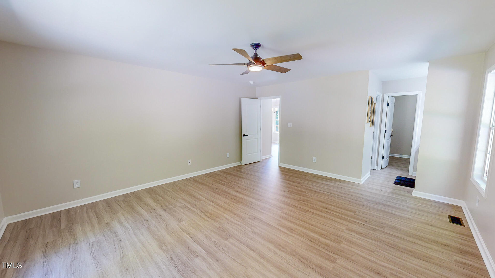 137 Dandelion Drive Timberlake, NC 27583 - Photo 25 of 53 wooden floor in an empty room with a window