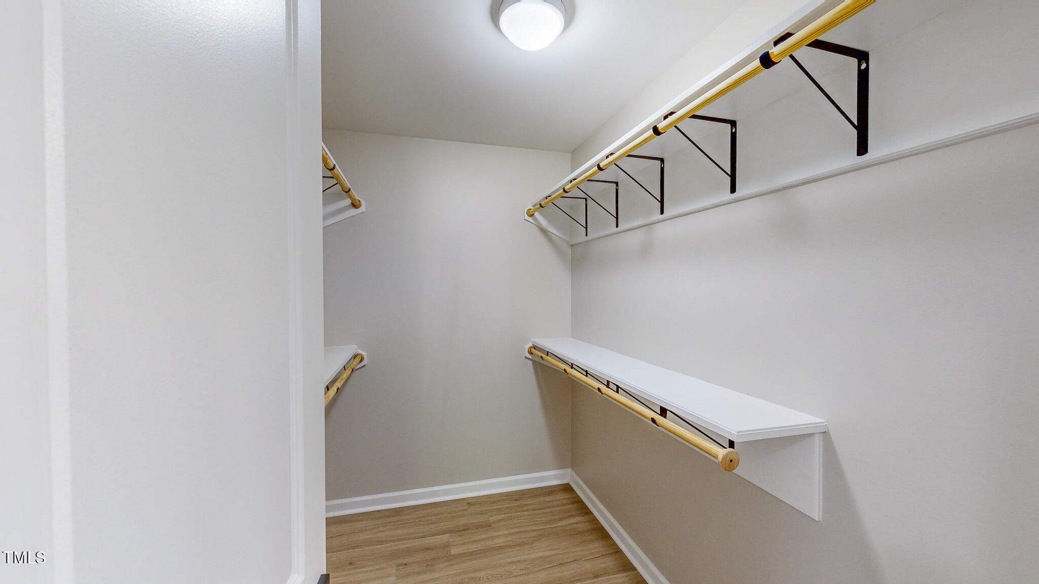 137 Dandelion Drive Timberlake, NC 27583 - Photo 31 of 53 a view of hallway with stairs and wooden floor