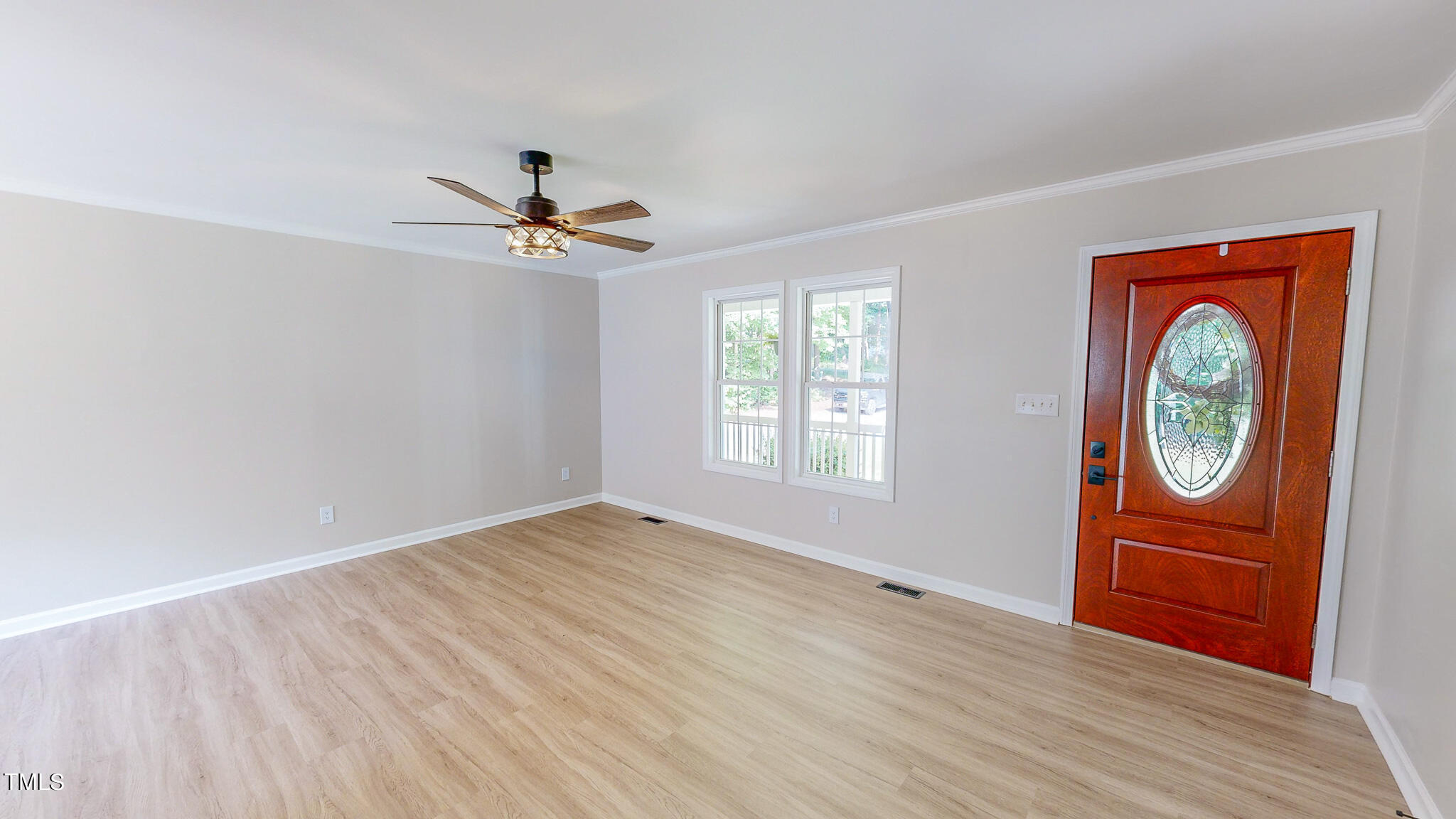 137 Dandelion Drive Timberlake, NC 27583 - Photo 32 of 53 an empty room with windows and fan