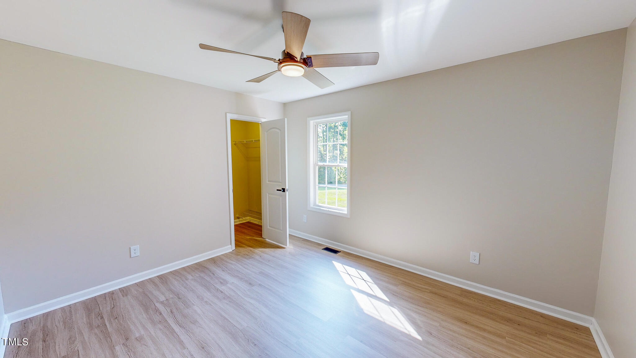 137 Dandelion Drive Timberlake, NC 27583 - Photo 34 of 53 wooden floor in an empty room with a window