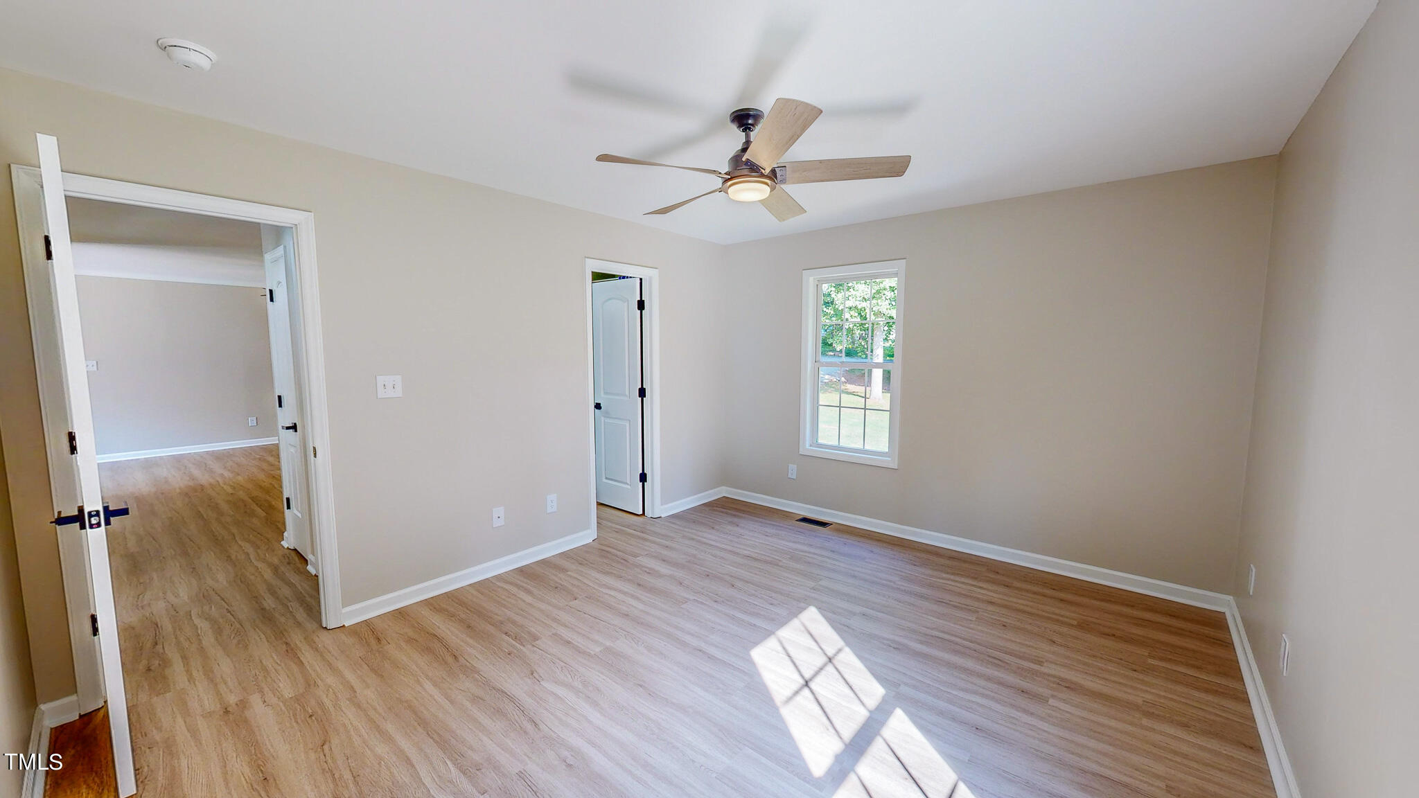 137 Dandelion Drive Timberlake, NC 27583 - Photo 37 of 53 wooden floor in an empty room with a window