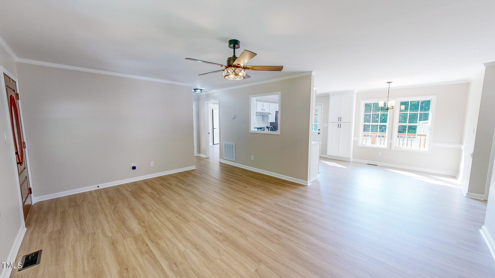 137 Dandelion Drive Timberlake, NC 27583 - Photo 4 of 53 wooden floor in an empty room with a window