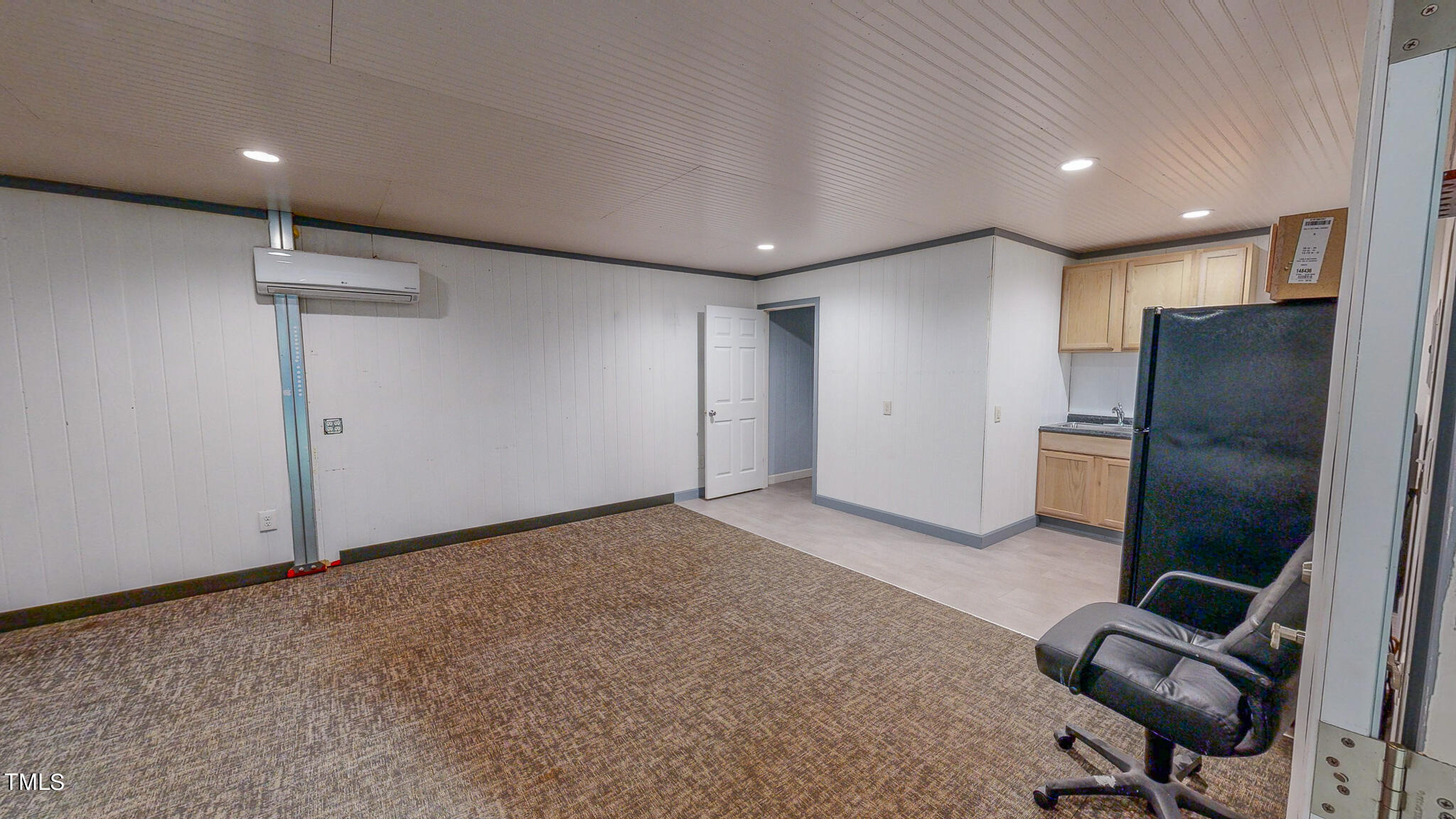 137 Dandelion Drive Timberlake, NC 27583 - Photo 50 of 53 a view of a livingroom with furniture and a refrigerator