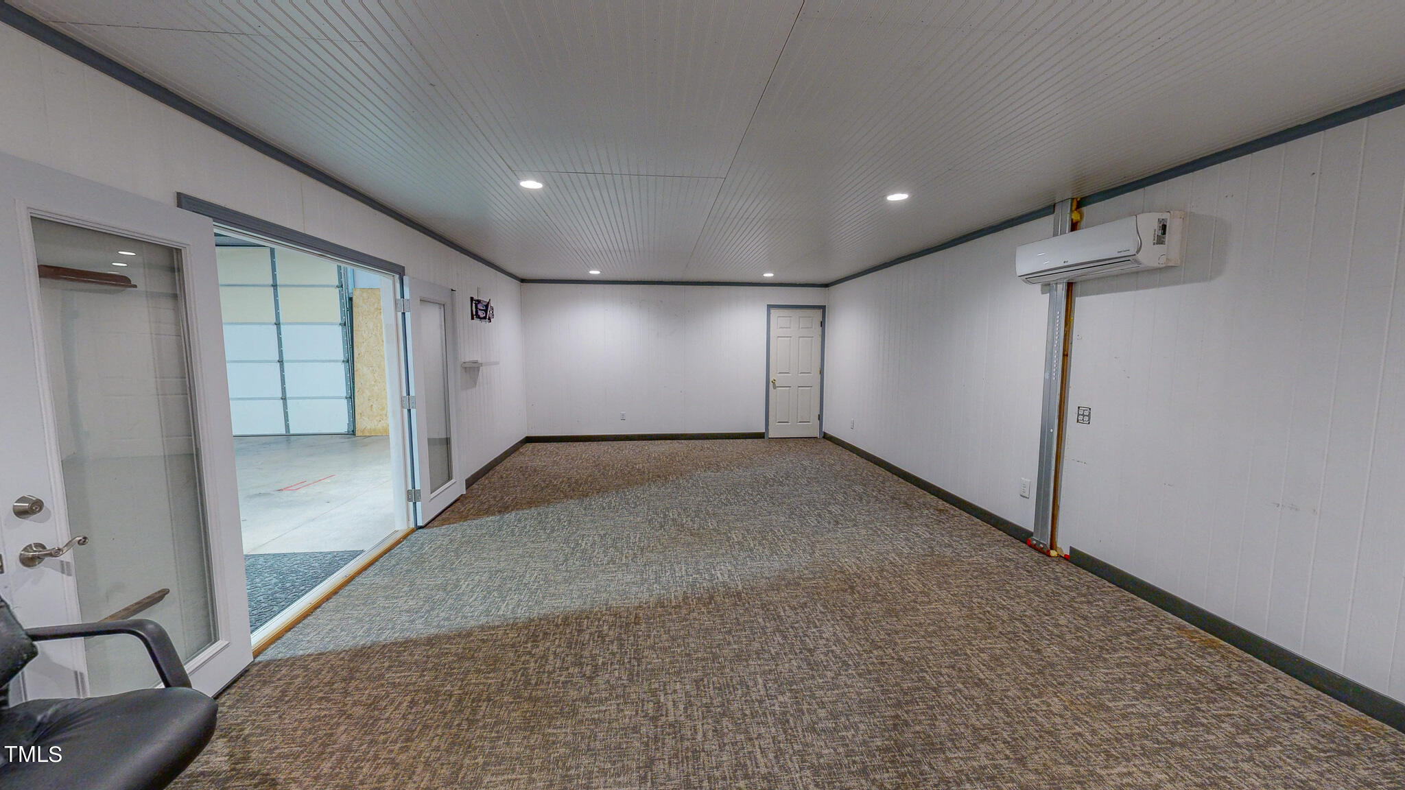 137 Dandelion Drive Timberlake, NC 27583 - Photo 51 of 53 an empty room with wooden floor and windows