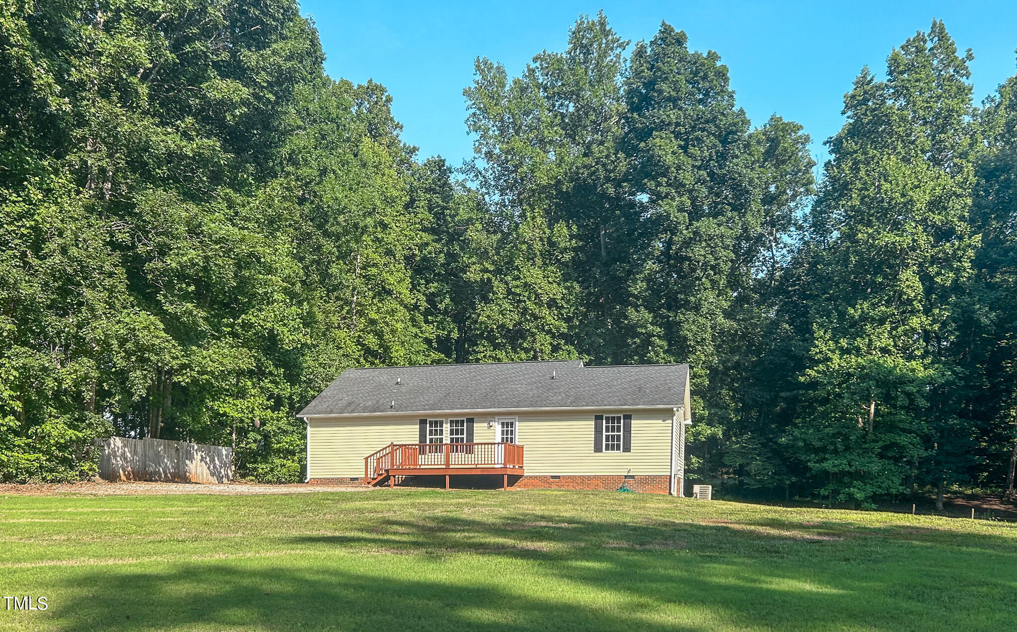 137 Dandelion Drive Timberlake, NC 27583 - Photo 53 of 53 a house view with a sitting space and garden