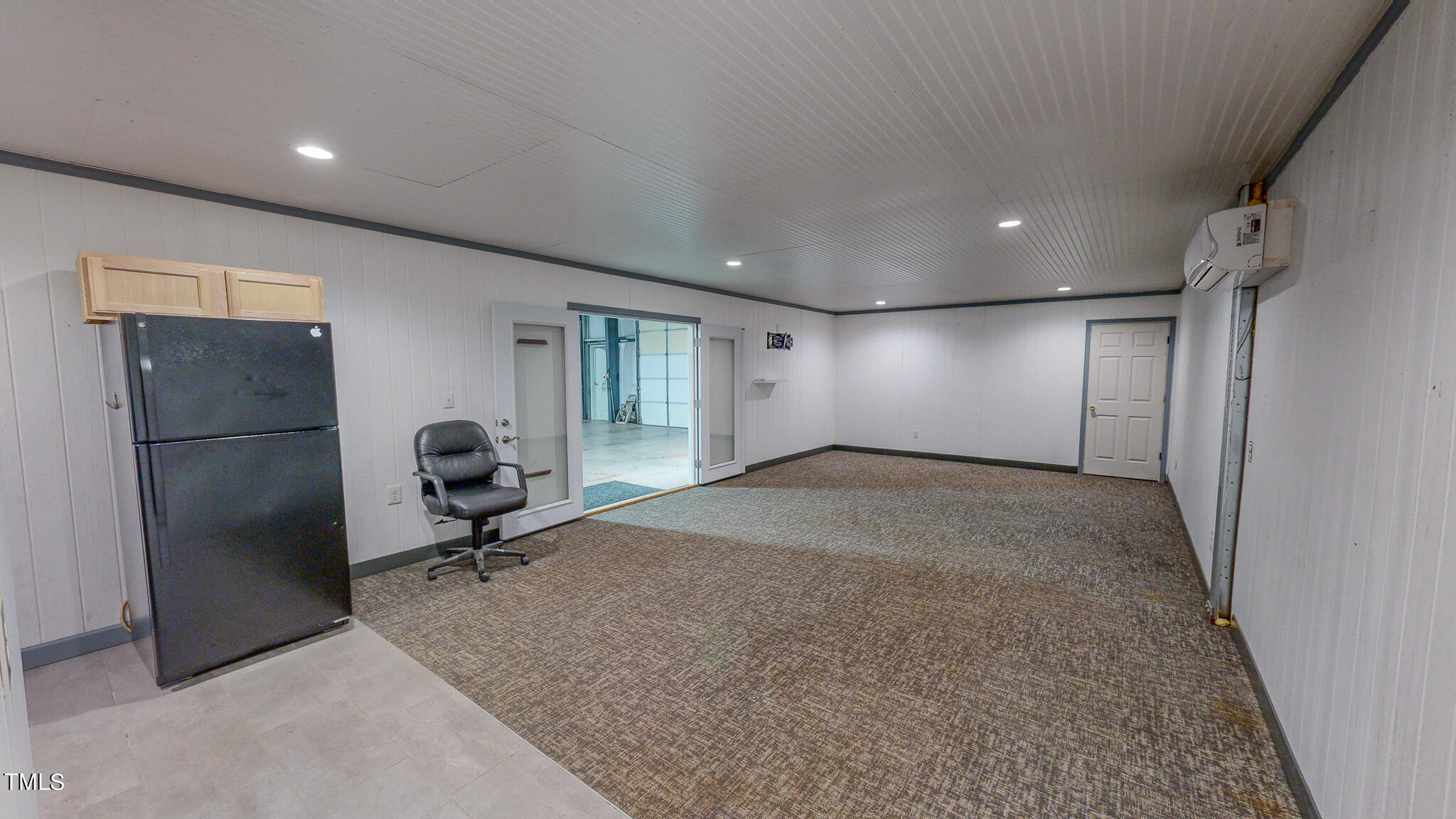 137 Dandelion Drive Timberlake, NC 27583 - Photo 7 of 53 a view of a livingroom with a couch and a refrigerator