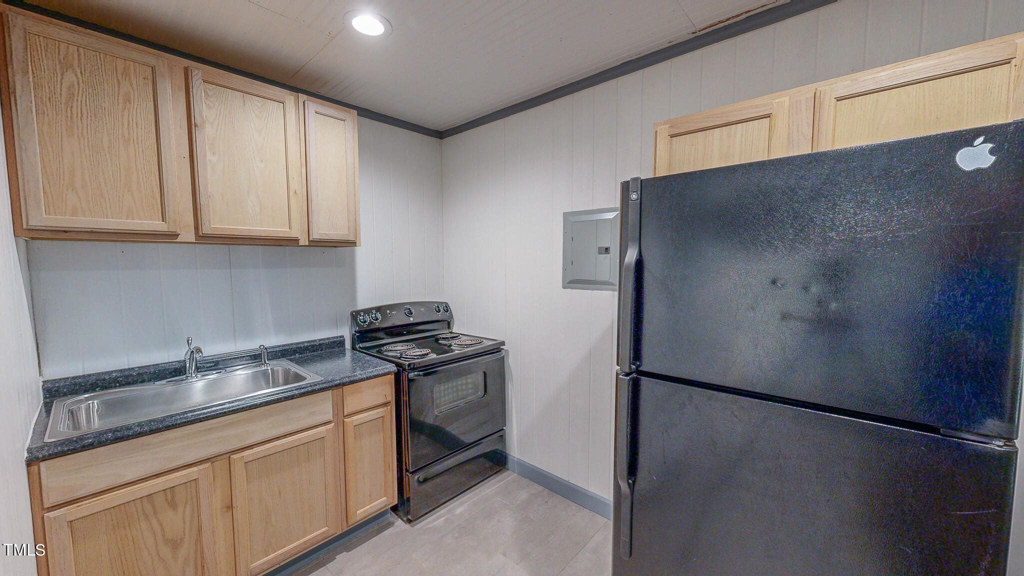 137 Dandelion Drive Timberlake, NC 27583 - Photo 8 of 53 a kitchen with stainless steel appliances granite countertop a refrigerator a sink and white cabinets