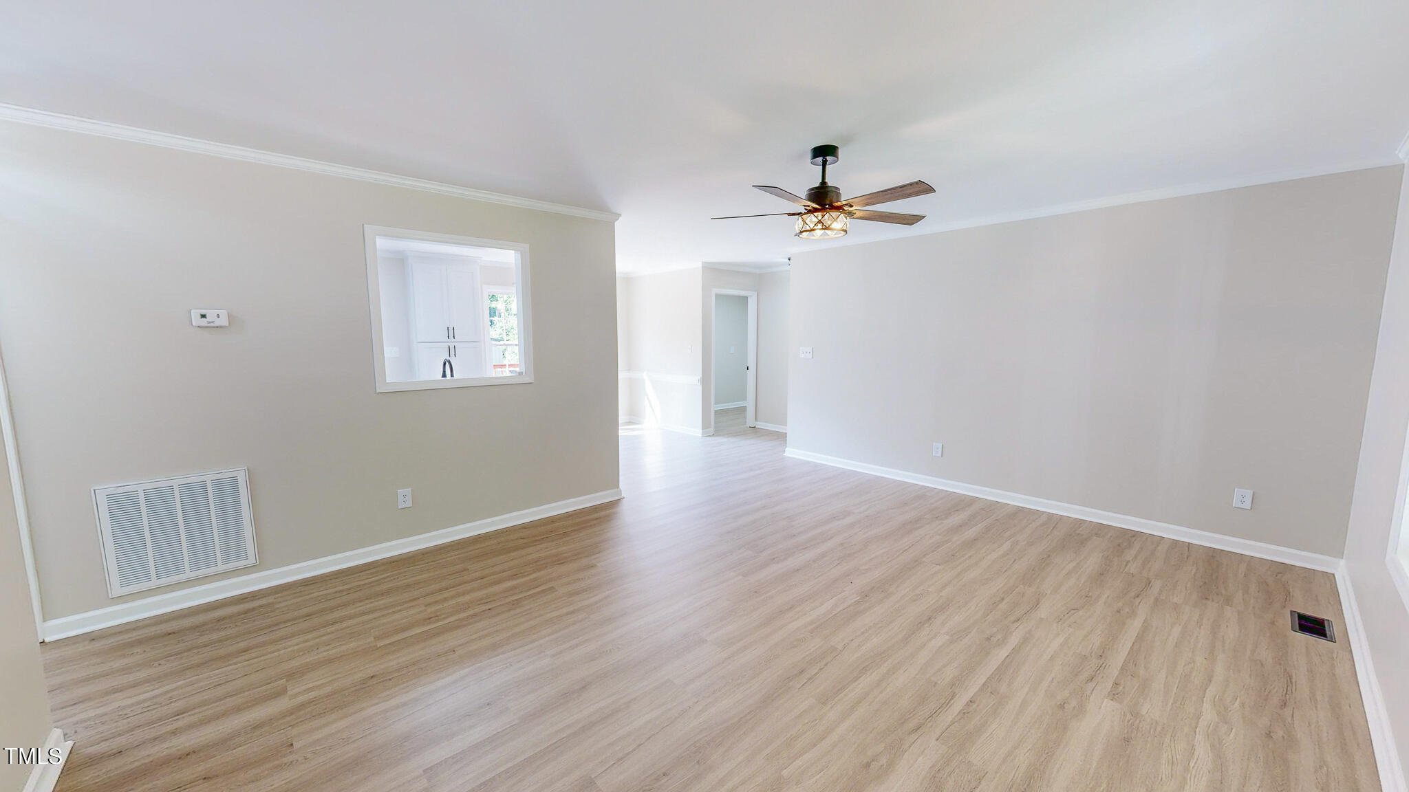 137 Dandelion Drive Timberlake, NC 27583 - Photo 10 of 53 wooden floor in an empty room with a window