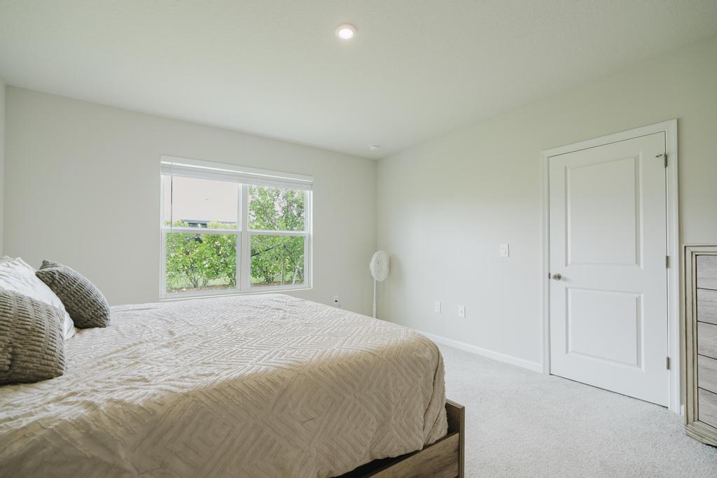 252 Raspberry Road Fort Pierce, FL 34981 - Photo 26 of 66 a bedroom with a bed and a window