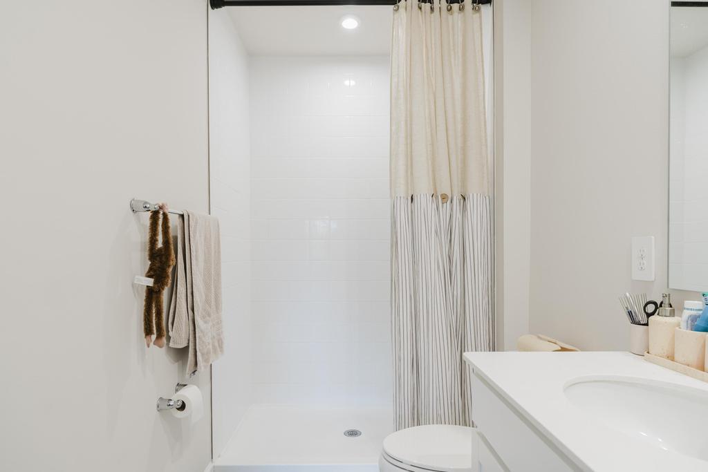 252 Raspberry Road Fort Pierce, FL 34981 - Photo 28 of 66 a bathroom with a sink toilet and vanity