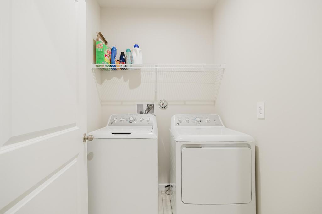 252 Raspberry Road Fort Pierce, FL 34981 - Photo 36 of 66 a utility room with dryer and washer