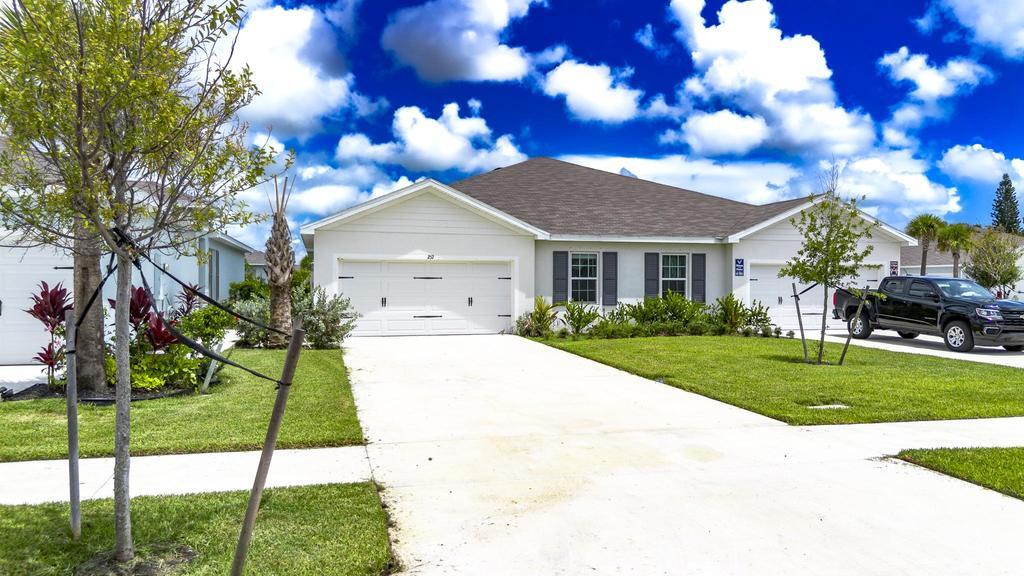 252 Raspberry Road Fort Pierce, FL 34981 - Photo 41 of 66 a house view with a garden space