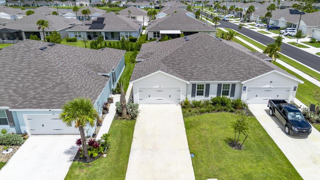 252 Raspberry Road Fort Pierce, FL 34981 - Photo 42 of 66 a aerial view of a house with yard patio and swimming pool