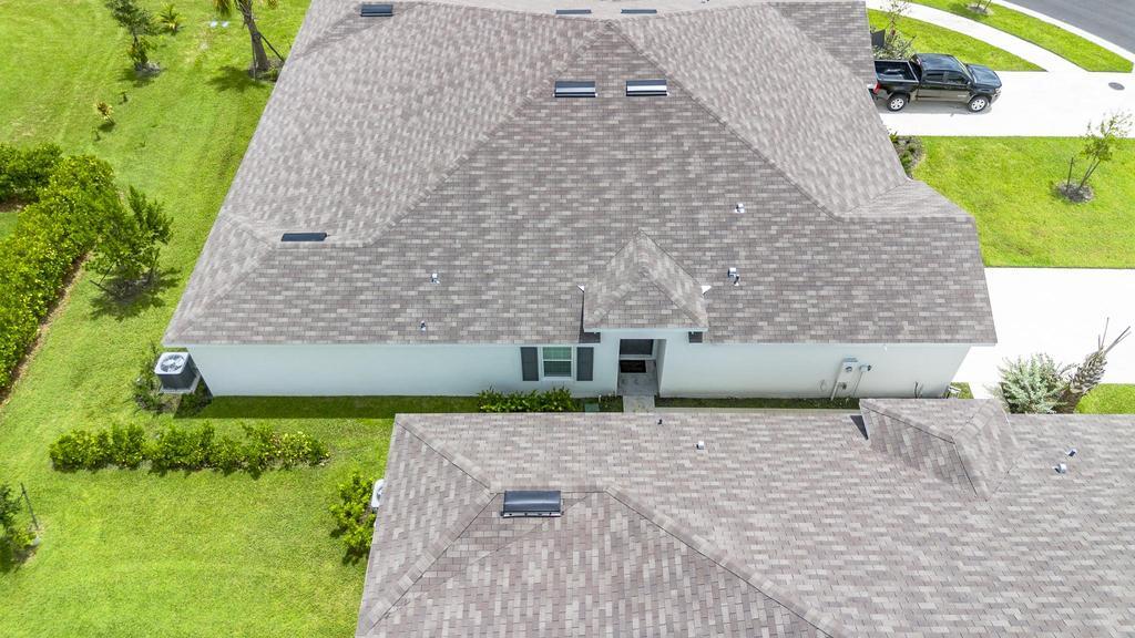 252 Raspberry Road Fort Pierce, FL 34981 - Photo 43 of 66 a front view of a house with a yard