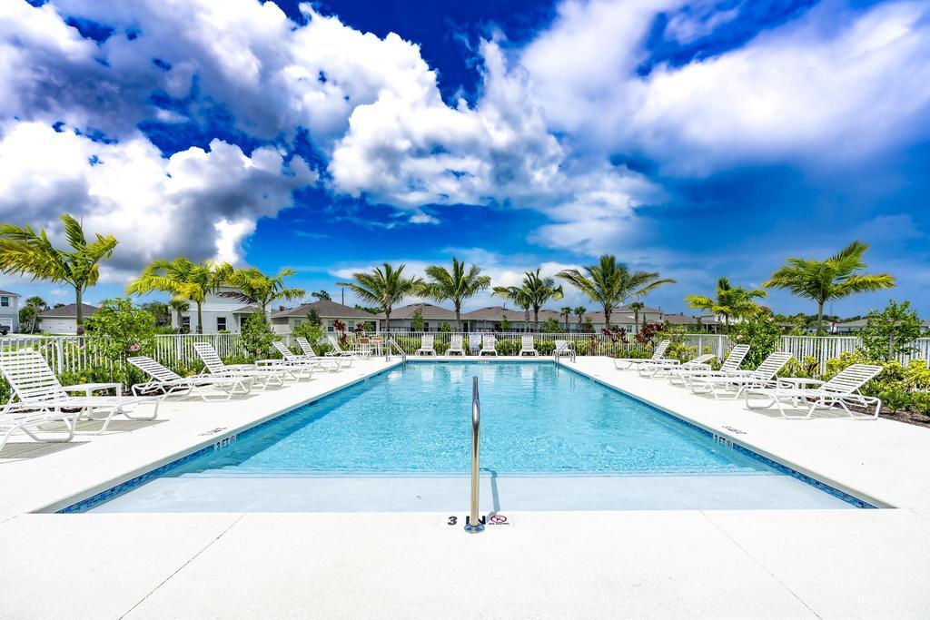 252 Raspberry Road Fort Pierce, FL 34981 - Photo 52 of 66 a view of swimming pool with outdoor seating