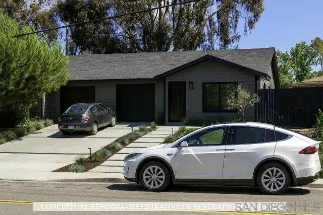 a front view of a house with parking space
