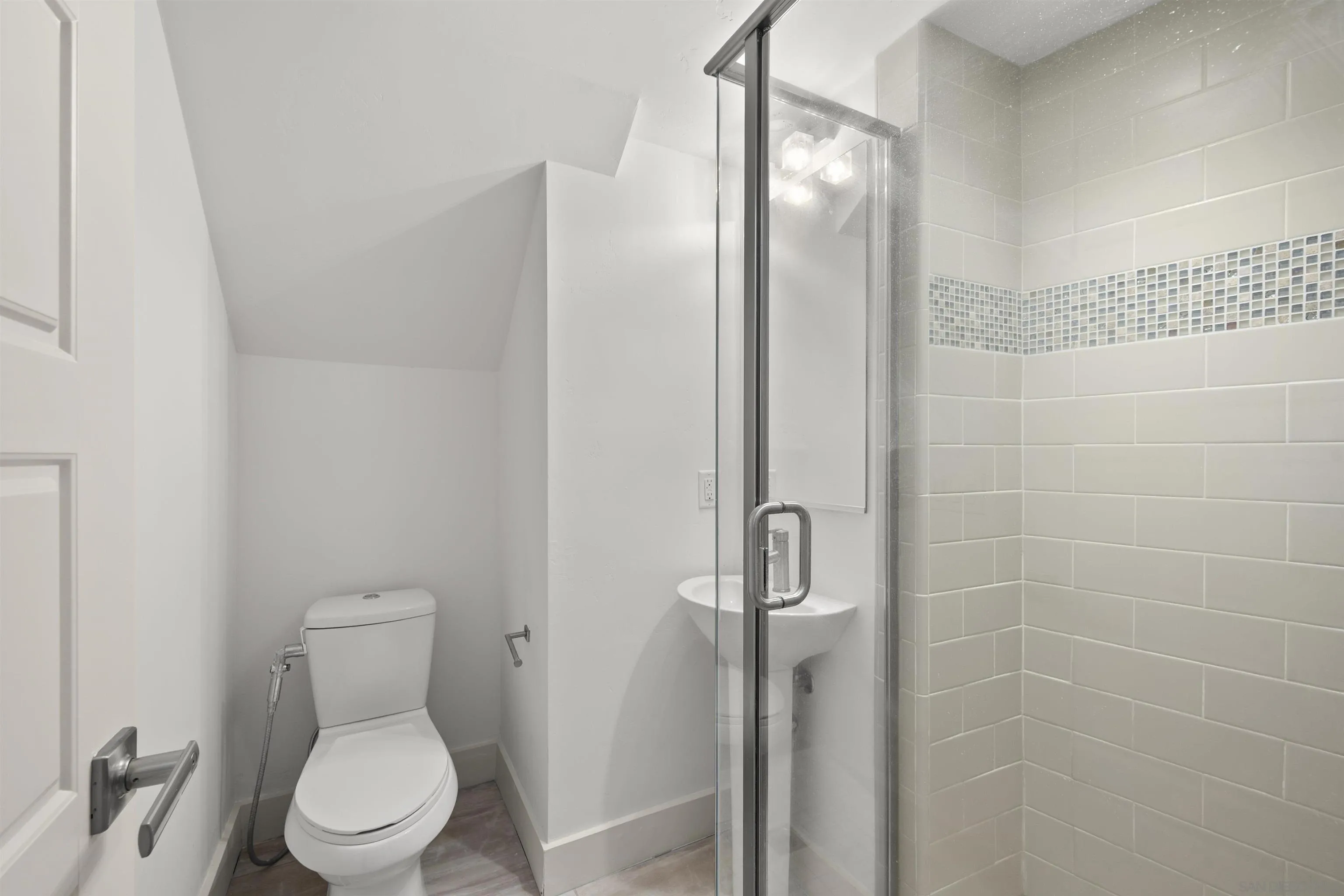 7853 Inception Way San Diego, CA 92108 - Photo 12 of 66 a white toilet sitting next to a bathroom sink