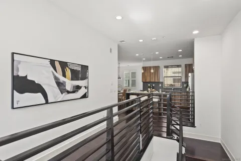 a living room with furniture wooden floor and a table