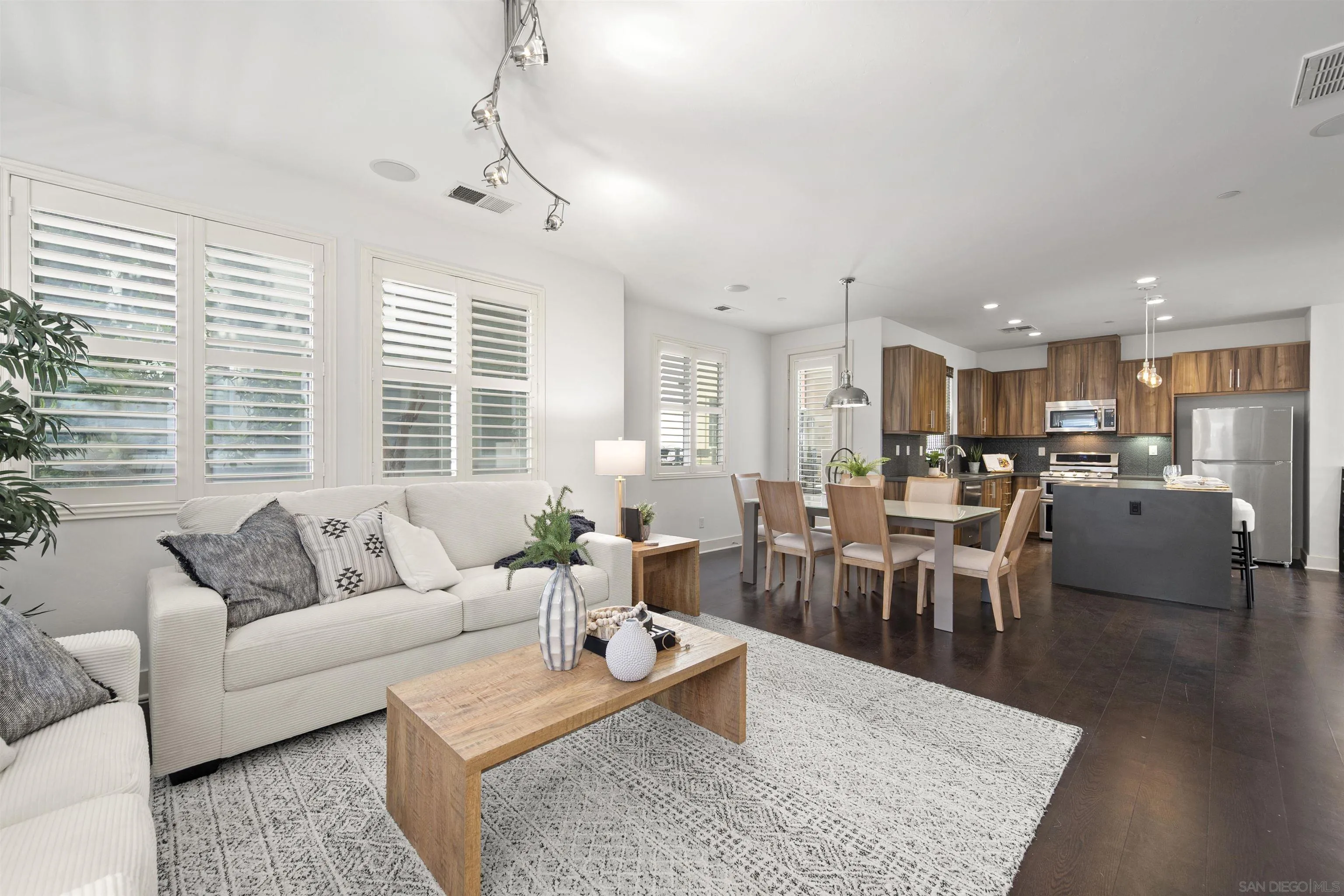 7853 Inception Way San Diego, CA 92108 - Photo 20 of 66 a living room with furniture wooden floor and a table