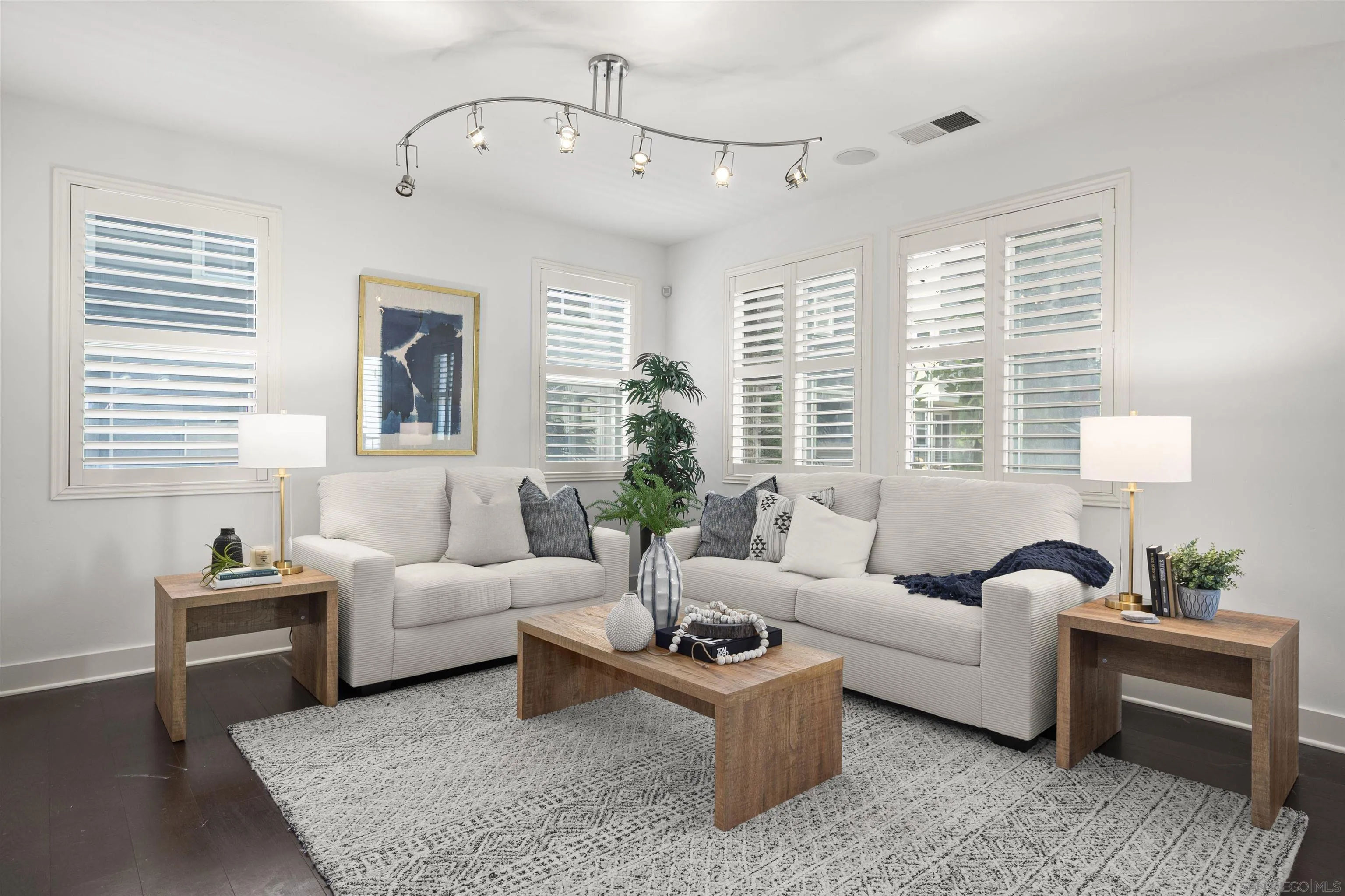 7853 Inception Way San Diego, CA 92108 - Photo 21 of 66 a living room with furniture and a large window