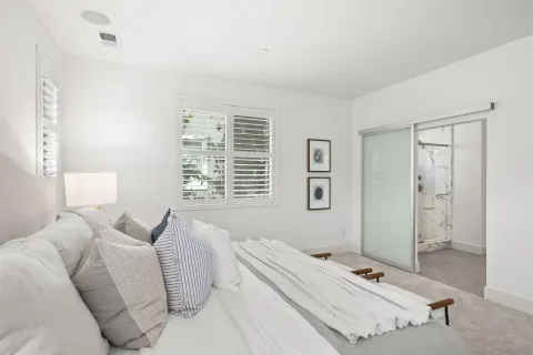 a front view of a building with palm trees