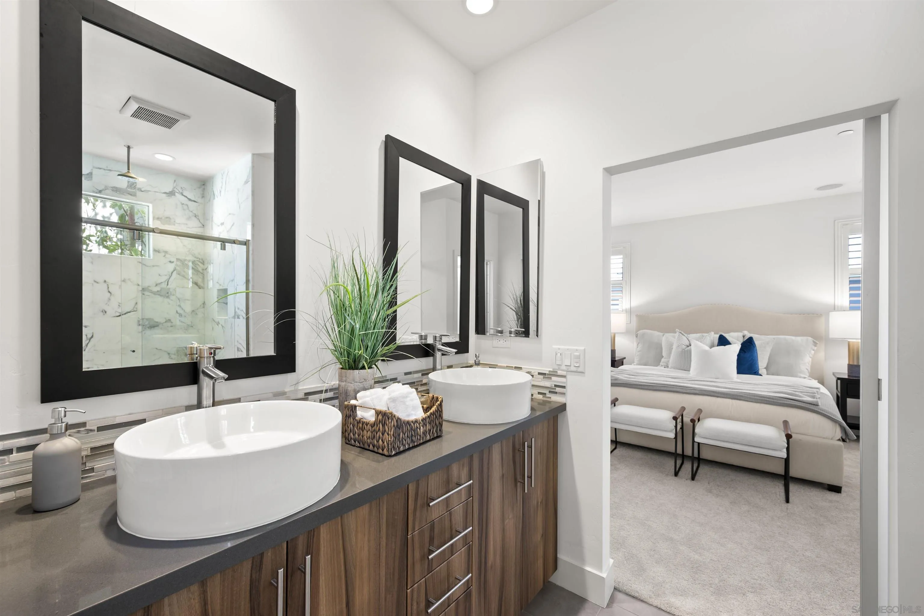7853 Inception Way San Diego, CA 92108 - Photo 31 of 66 a bathroom with a double vanity sink and a mirror