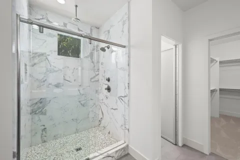 an aerial view of a swimming pool patio and outdoor seating