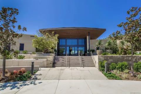 a view of a patio with a table and chairs under an umbrella