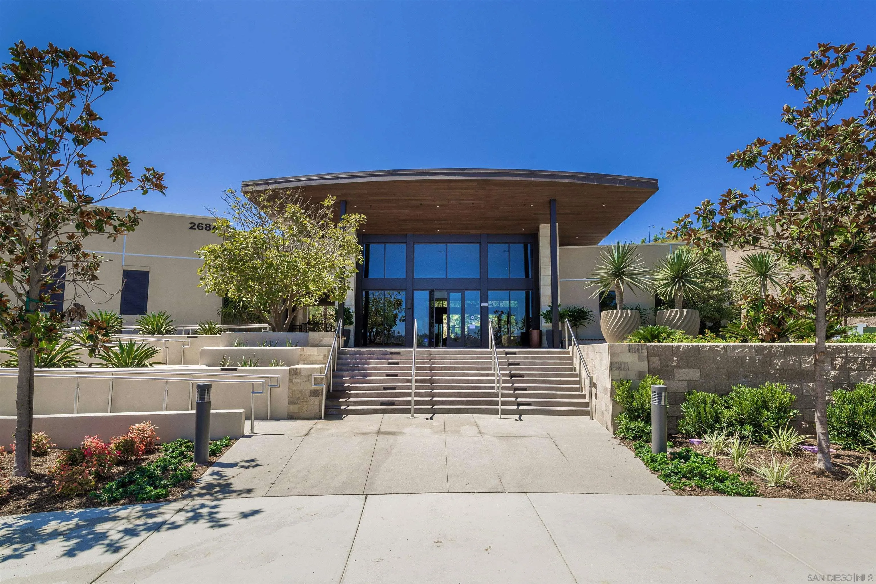 7853 Inception Way San Diego, CA 92108 - Photo 49 of 66 a front view of a house with a garden