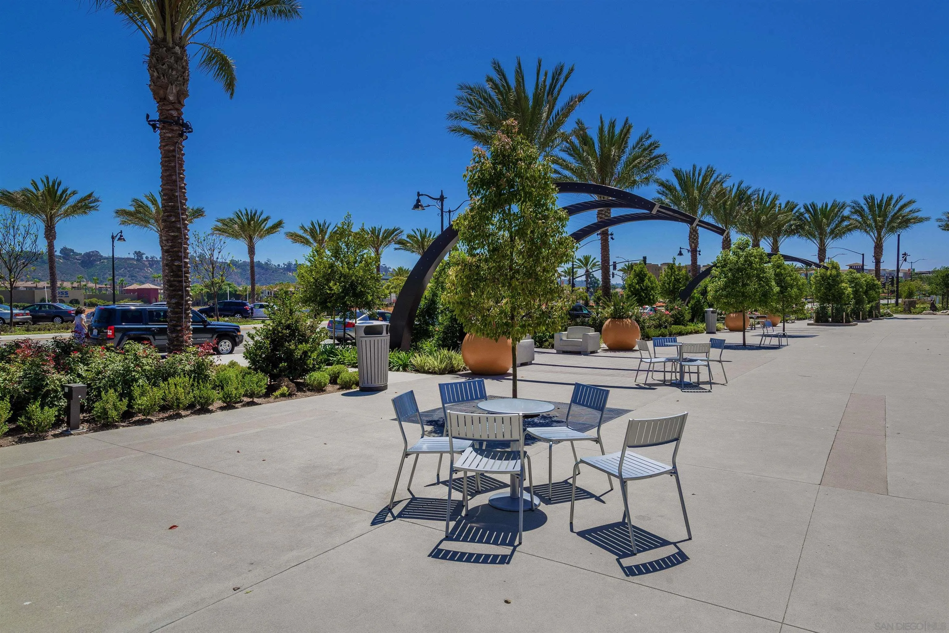 7853 Inception Way San Diego, CA 92108 - Photo 63 of 66 a view of a patio with a table and chairs under an umbrella