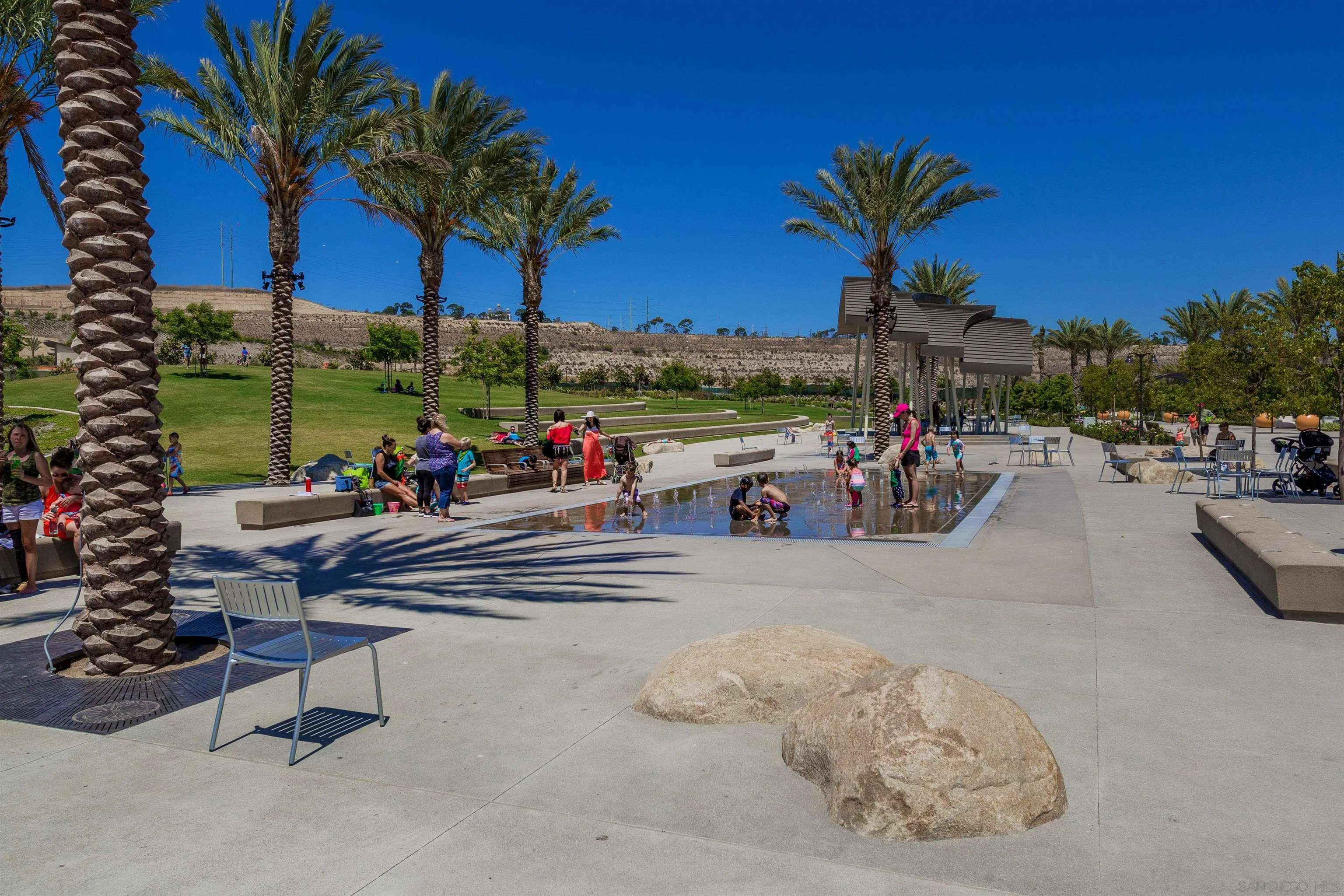 7853 Inception Way San Diego, CA 92108 - Photo 65 of 66 a view of a swimming pool with a table and chairs